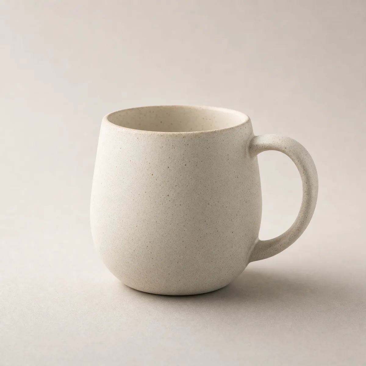 Arc Mug on a warm putty studio backdrop